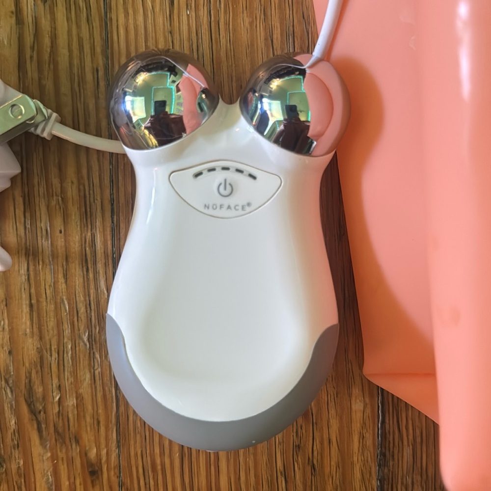 NuFace White Toning Device with power adapter and silicone bag
